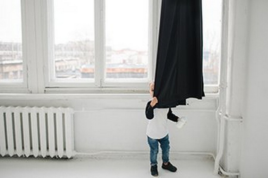 Boy Behind Curtain
