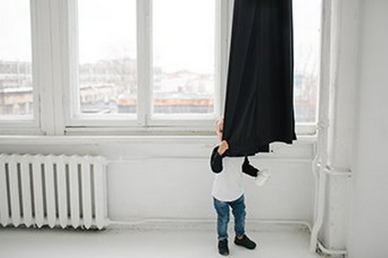Boy Behind Curtain