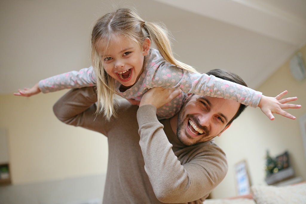 Father plays with daughter